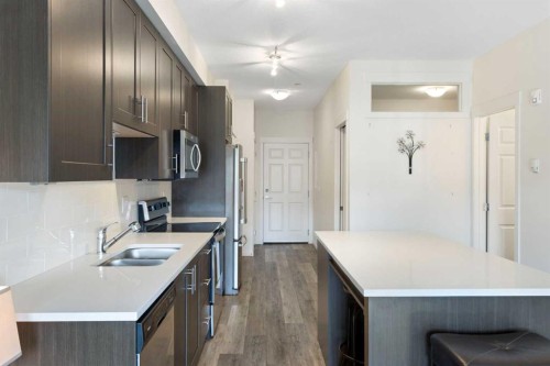 1106-298 Sage Meadows Park Nw, Calgary, AB - Indoor Photo Showing Kitchen With Double Sink With Upgraded Kitchen