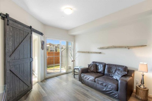 1106-298 Sage Meadows Park Nw, Calgary, AB - Indoor Photo Showing Living Room
