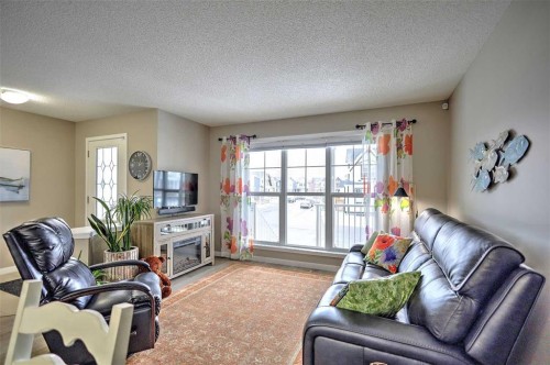 388 Auburn Crest Way Se, Calgary, AB - Indoor Photo Showing Living Room With Fireplace