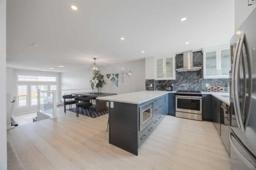 190 Magnolia Square Se, Calgary, AB - Indoor Photo Showing Kitchen With Upgraded Kitchen