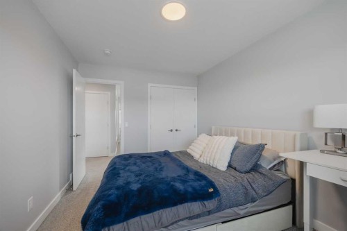 190 Magnolia Square Se, Calgary, AB - Indoor Photo Showing Bedroom