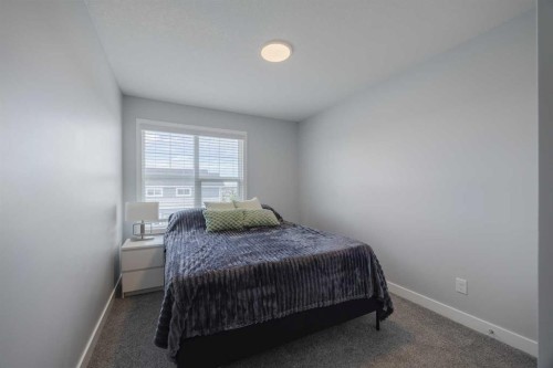 190 Magnolia Square Se, Calgary, AB - Indoor Photo Showing Bedroom