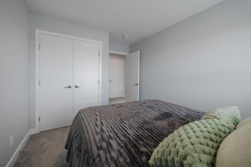 190 Magnolia Square Se, Calgary, AB - Indoor Photo Showing Bedroom
