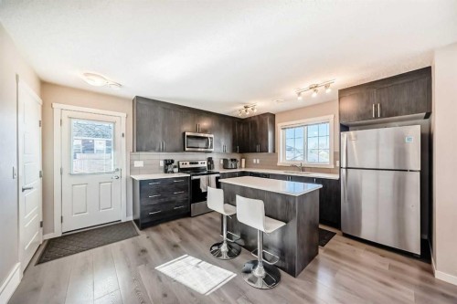 1434-7451 Falconridge Boulevard Ne, Calgary, AB - Indoor Photo Showing Kitchen With Stainless Steel Kitchen