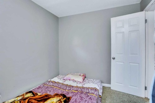 54 Taracove Road Ne, Calgary, AB - Indoor Photo Showing Bedroom