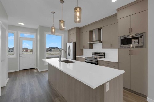 2022 Cobblebrook Crescent Sw, Airdrie, AB - Indoor Photo Showing Kitchen With Upgraded Kitchen
