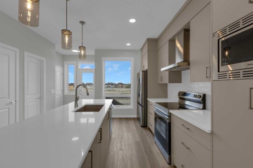 2022 Cobblebrook Crescent Sw, Airdrie, AB - Indoor Photo Showing Kitchen With Upgraded Kitchen