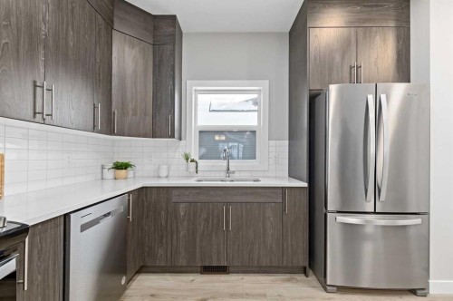 943 Legacy Circle Se, Calgary, AB - Indoor Photo Showing Kitchen With Stainless Steel Kitchen With Double Sink