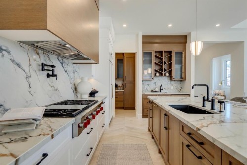 8 Calais Lane Sw, Calgary, AB - Indoor Photo Showing Kitchen With Upgraded Kitchen