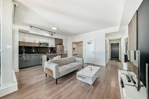 423-619 Confluence Way Se, Calgary, AB - Indoor Photo Showing Living Room