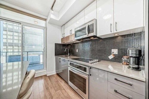 423-619 Confluence Way Se, Calgary, AB - Indoor Photo Showing Kitchen With Upgraded Kitchen