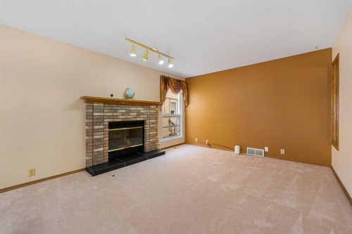 91 Coral Springs Boulevard Ne, Calgary, AB - Indoor With Fireplace