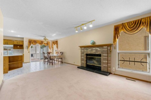 91 Coral Springs Boulevard Ne, Calgary, AB - Indoor Photo Showing Living Room With Fireplace