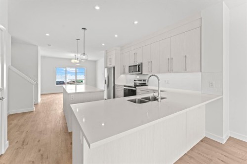 7654 202 Avenue Se, Calgary, AB - Indoor Photo Showing Kitchen With Double Sink With Upgraded Kitchen