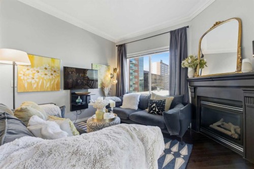 404-881 15 Avenue Sw, Calgary, AB - Indoor Photo Showing Living Room With Fireplace