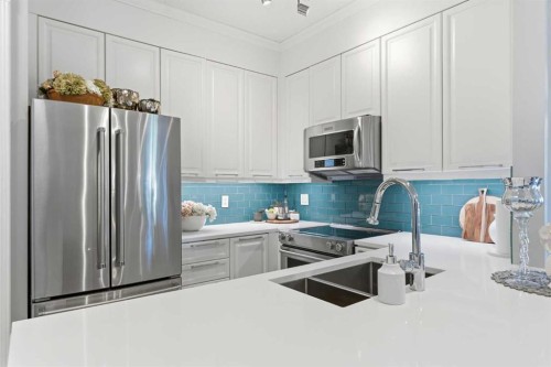 404-881 15 Avenue Sw, Calgary, AB - Indoor Photo Showing Kitchen With Stainless Steel Kitchen With Double Sink With Upgraded Kitchen