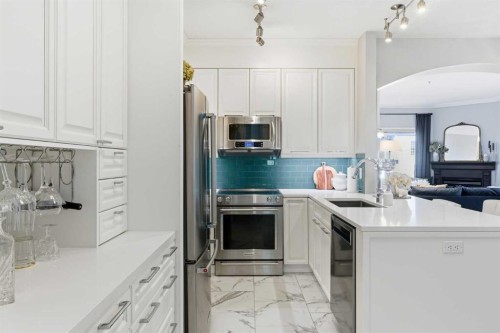 404-881 15 Avenue Sw, Calgary, AB - Indoor Photo Showing Kitchen With Stainless Steel Kitchen With Upgraded Kitchen
