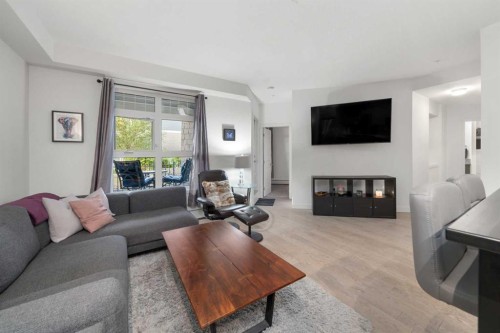 34-25 Auburn Meadows Avenue Se, Calgary, AB - Indoor Photo Showing Living Room With Fireplace