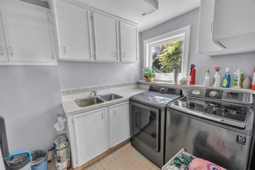 303 Ranchridge Bay Nw, Calgary, AB - Indoor Photo Showing Laundry Room