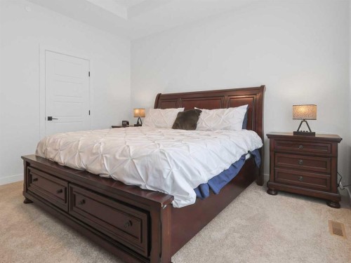 110 Sunstone Way, Balzac, AB - Indoor Photo Showing Bedroom