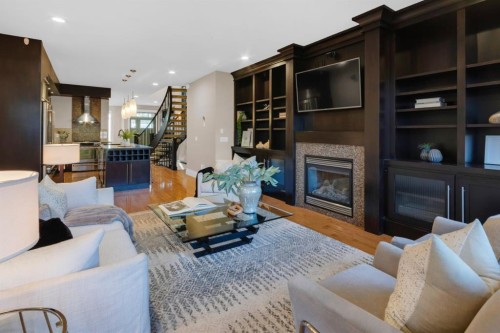2046 49 Avenue Sw, Calgary, AB - Indoor Photo Showing Living Room With Fireplace