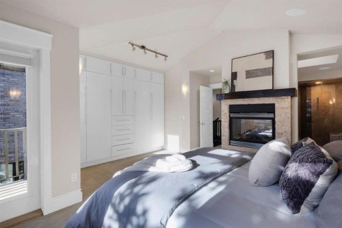 2046 49 Avenue Sw, Calgary, AB - Indoor Photo Showing Bedroom With Fireplace