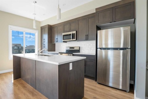 372 Canals Crossing Sw, Airdrie, AB - Indoor Photo Showing Kitchen With Upgraded Kitchen