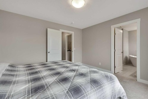 216 Creekstone Row Sw, Calgary, AB - Indoor Photo Showing Bedroom