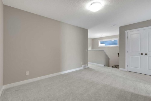 216 Creekstone Row Sw, Calgary, AB - Indoor Photo Showing Other Room