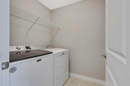216 Creekstone Row Sw, Calgary, AB - Indoor Photo Showing Laundry Room