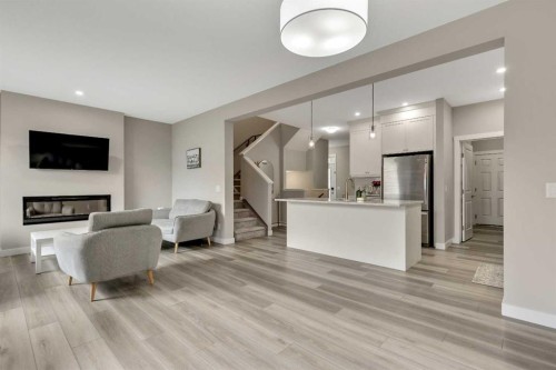 216 Creekstone Row Sw, Calgary, AB - Indoor With Fireplace