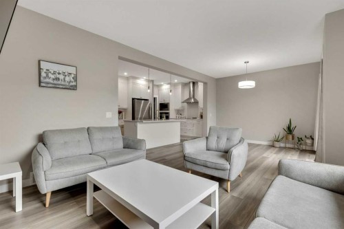 216 Creekstone Row Sw, Calgary, AB - Indoor Photo Showing Living Room