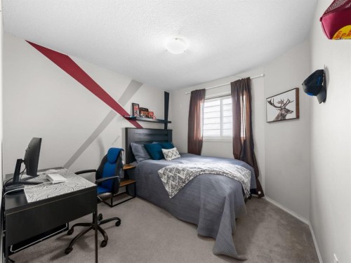97 Evansbrooke Way Nw, Calgary, AB - Indoor Photo Showing Bedroom