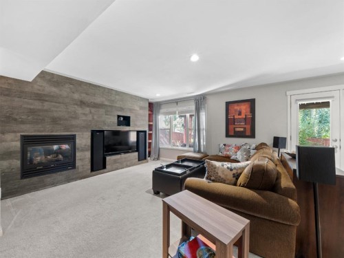 97 Evansbrooke Way Nw, Calgary, AB - Indoor Photo Showing Living Room With Fireplace