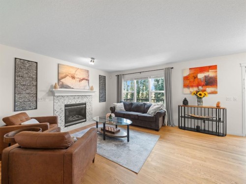 97 Evansbrooke Way Nw, Calgary, AB - Indoor Photo Showing Living Room With Fireplace