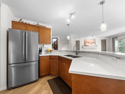 97 Evansbrooke Way Nw, Calgary, AB - Indoor Photo Showing Kitchen With Double Sink