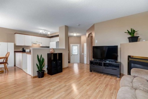 168 Mt Apex Green Se, Calgary, AB - Indoor Photo Showing Living Room With Fireplace