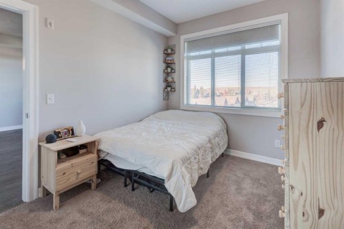 401-117 Copperpond Common Se, Calgary, AB - Indoor Photo Showing Bedroom