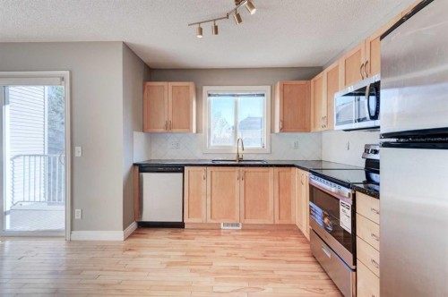 66 Cedarwood Lane Sw, Calgary, AB - Indoor Photo Showing Kitchen With Stainless Steel Kitchen