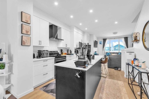 52 Edith Gate Nw, Calgary, AB - Indoor Photo Showing Kitchen With Upgraded Kitchen