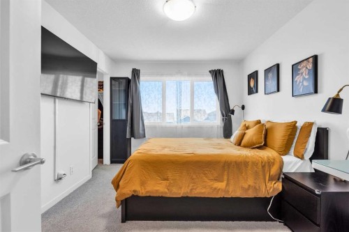 52 Edith Gate Nw, Calgary, AB - Indoor Photo Showing Bedroom