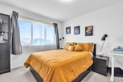 52 Edith Gate Nw, Calgary, AB - Indoor Photo Showing Bedroom