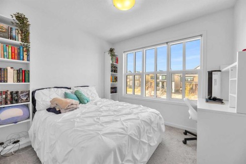52 Edith Gate Nw, Calgary, AB - Indoor Photo Showing Bedroom