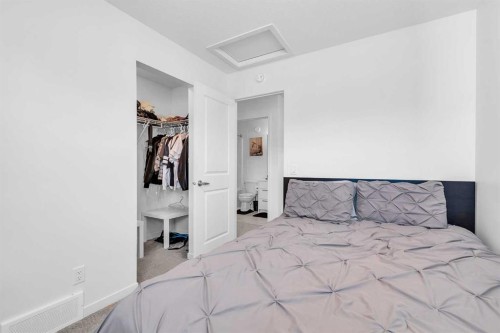 52 Edith Gate Nw, Calgary, AB - Indoor Photo Showing Bedroom