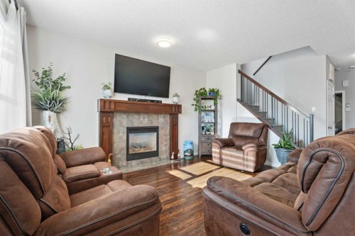 106 Copperstone Close Se, Calgary, AB - Indoor Photo Showing Living Room With Fireplace