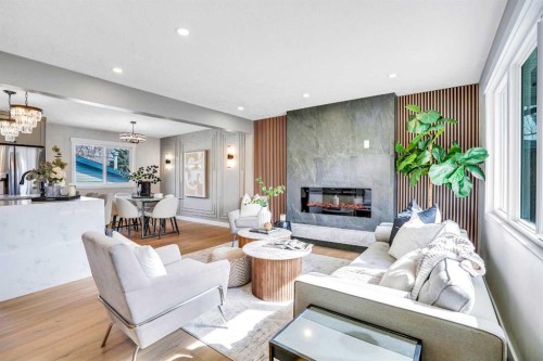 146 Springwood Drive Sw, Calgary, AB - Indoor Photo Showing Living Room With Fireplace