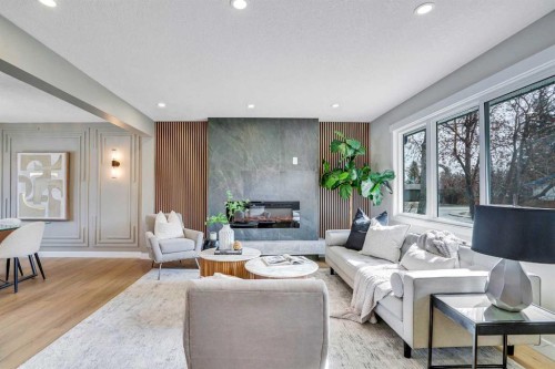 146 Springwood Drive Sw, Calgary, AB - Indoor Photo Showing Living Room With Fireplace