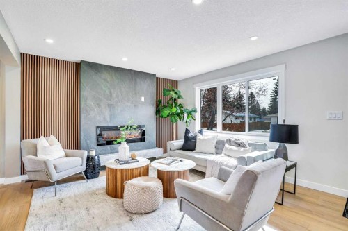 146 Springwood Drive Sw, Calgary, AB - Indoor Photo Showing Living Room With Fireplace