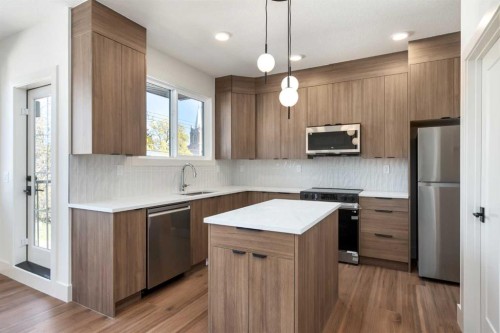 716 18 Avenue Nw, Calgary, AB - Indoor Photo Showing Kitchen With Stainless Steel Kitchen