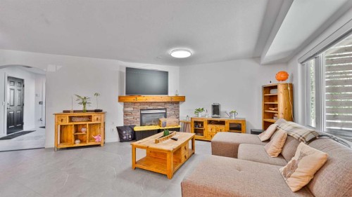 148 Covepark Close Ne, Calgary, AB - Indoor Photo Showing Living Room With Fireplace